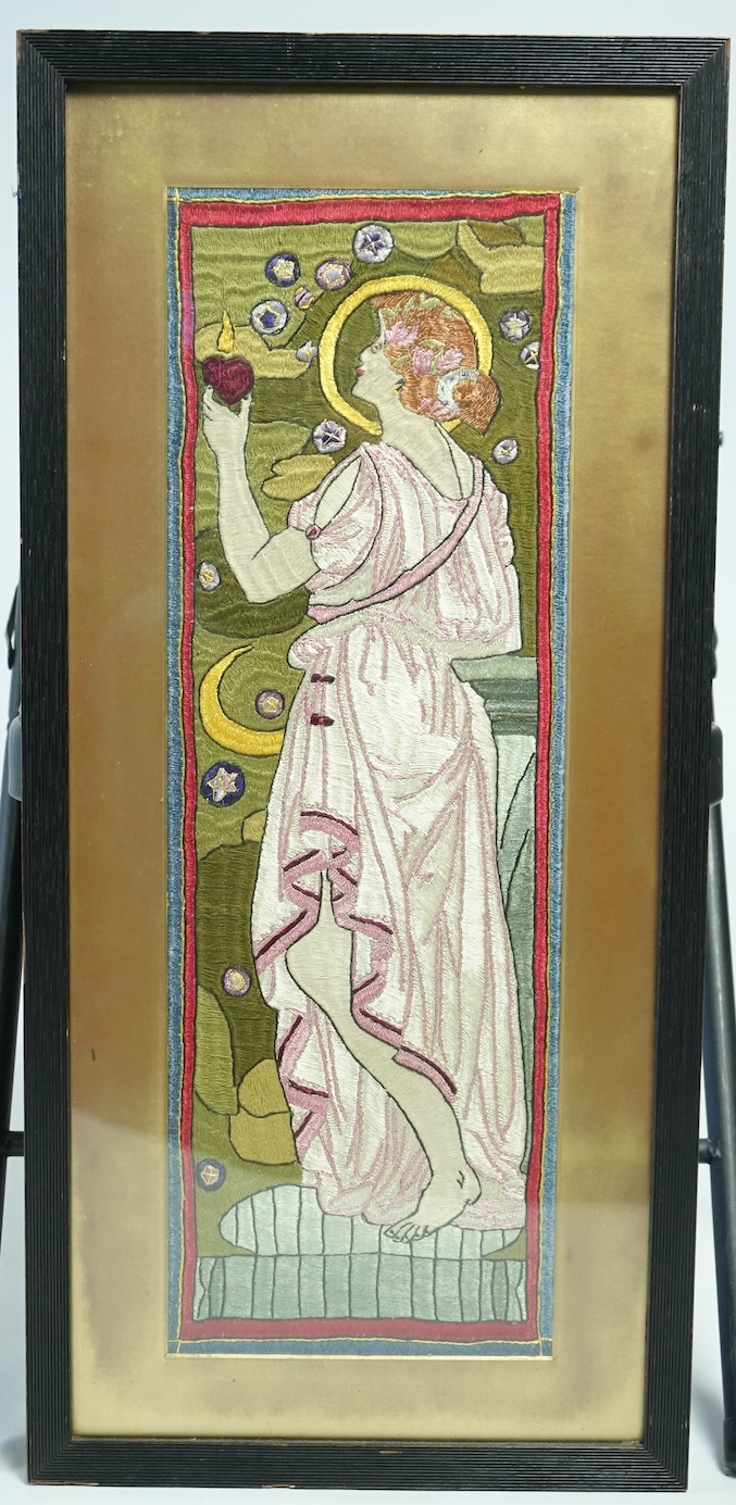 A late 19th century early 20th century framed silk embroidery in the Glasgow School manner, of a lady in classical dress, unsigned. 63 cm high x 22cm wide. Condition - the colours are strong and unfaded. There is damage.